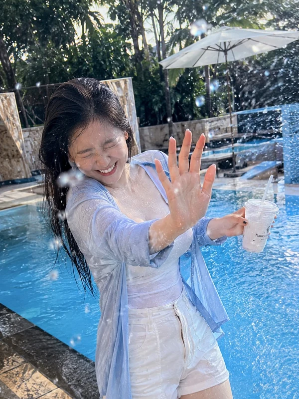 Blue summer shirt beside a pool